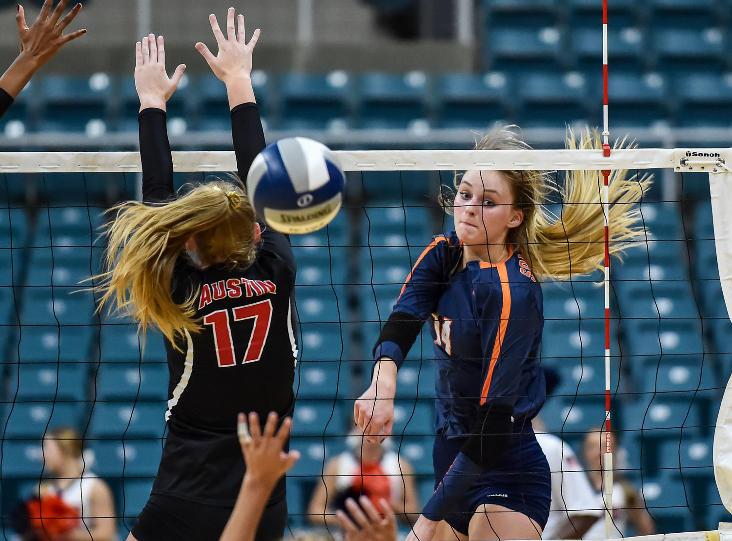 Seven Lakes’ Ally Batenhorst, voted the most outstanding hitter for District 19-6A last year, recently collected national preseason recognition from MaxPreps and the American Volleyball Coaches Association. Pictured is Batenhorst, 14, delivering a spike past Fort Bend Austin’s Sydney Plemons, 17, during a high school volleyball playoff match at the Merrell Center in Katy on Nov. 5, 2019.